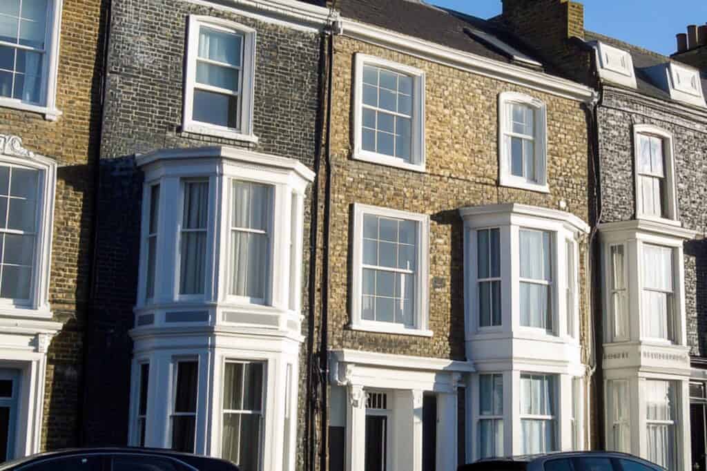 Cropped image of a row of Victorian terraced townhouses in the concept of 'best affordable housing options in Islington'.
