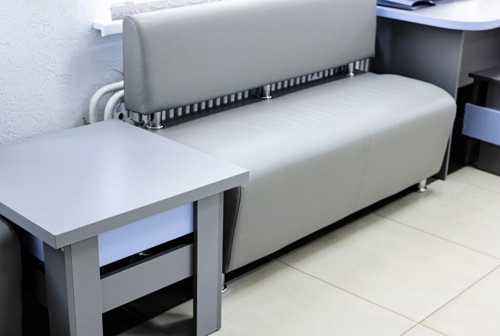 Small side table and sofa in an office's waiting area